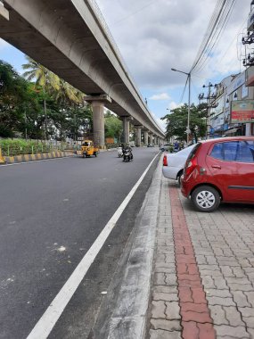 Bangalore, Karnataka, India-Jun 09 2021: Closeup of empty roads due to covid 19 lockdown rules restriction, for transport in a Bangalore, Yelachenahalli Metro Station Road looks beautiful and clean