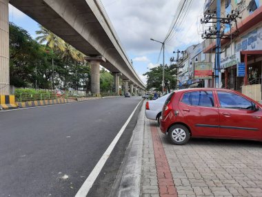 Bangalore, Karnataka, India-Jun 09 2021: Closeup of empty roads due to covid 19 lockdown rules restriction, for transport in a Bangalore, Yelachenahalli Metro Station Road looks beautiful and clean
