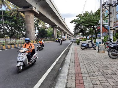 Bangalore, Karnataka, India-Jun 09 2021: Closeup of empty roads due to covid 19 lockdown rules restriction, for transport in a Bangalore, Yelachenahalli Metro Station Road looks beautiful and clean