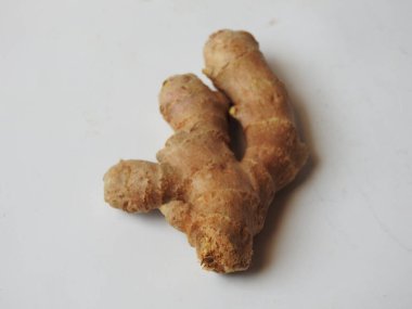 Group of Spice and Medicinal Fresh ginger rhizome with green leaves isolated on white background.