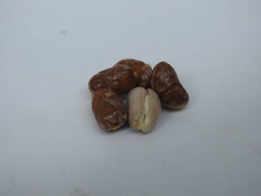 Closeup of Golden Yellow Color young and raw Zehidi Dates with seeds isolated on white background