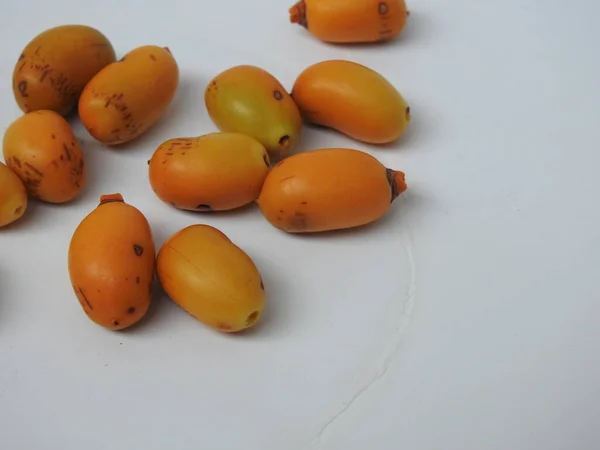 Closeup Golden Yellow Color Young Raw Zehidi Dates Seeds Isolated — Stock Fotó