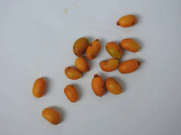 Closeup Golden Yellow Color Young Raw Zehidi Dates Seeds Isolated — Fotografia de Stock