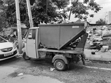 Bangalore, Karnataka, India-June 16 2021: Closeup of Bangalore Municipal Corporation has arranged garbage collection van or auto in the city for solid waste management.