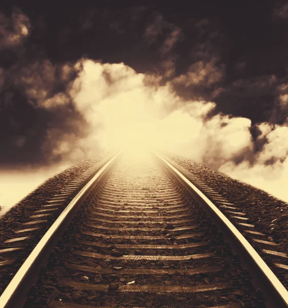 Railway to horizon under dramatic sky — Stock Photo, Image