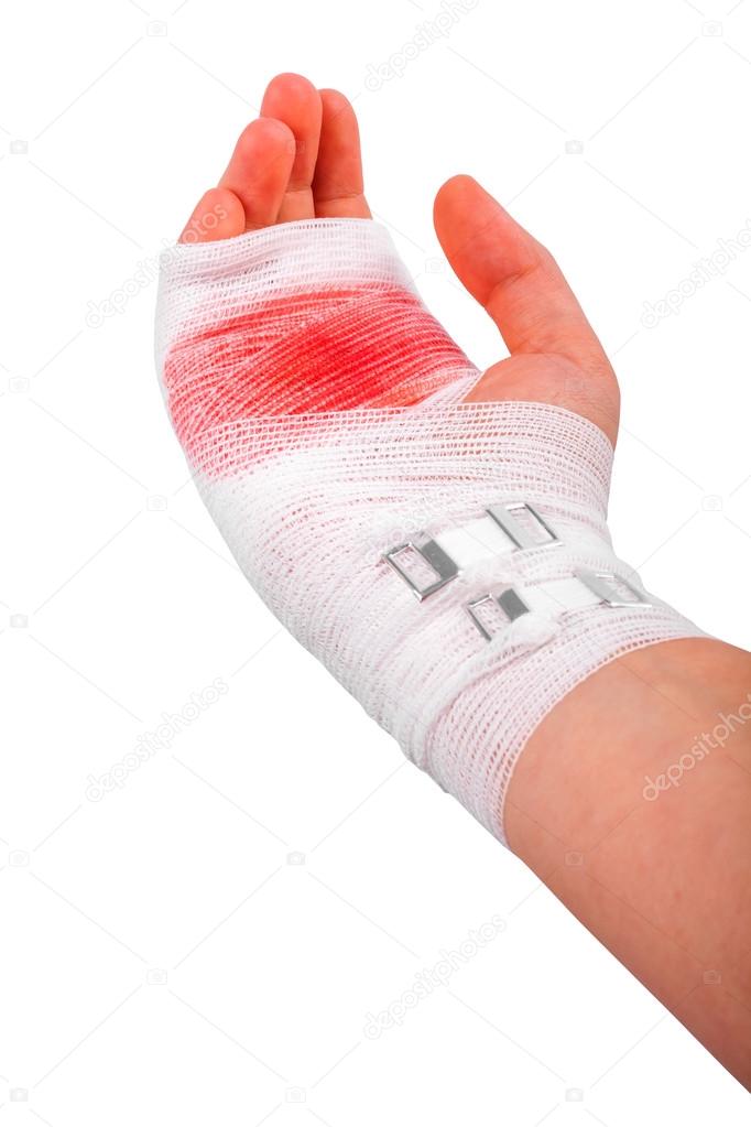 The injured isolated hand of the girl tied up by white bandage