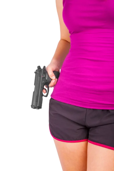 Mulher usando shorts com arma na mão — Fotografia de Stock