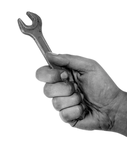Schmutzige Hand hält Schraubenschlüssel isoliert auf weißem Hintergrund — Stockfoto