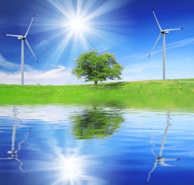 Alan, ağaç ve mavi gökyüzü Rüzgar türbinleri ile