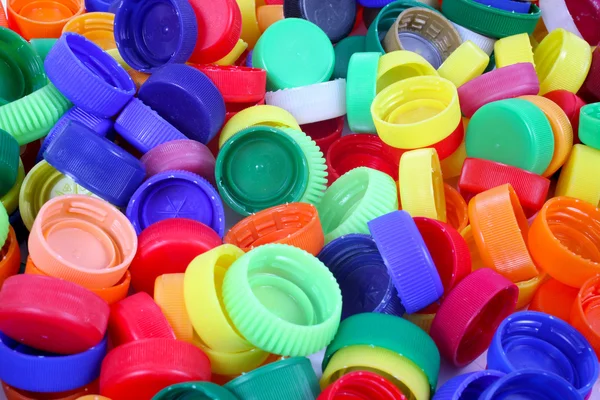 Color plastic caps background — Stock Photo, Image