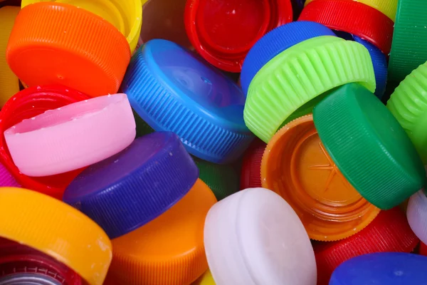 Color plastic caps background — Stock Photo, Image