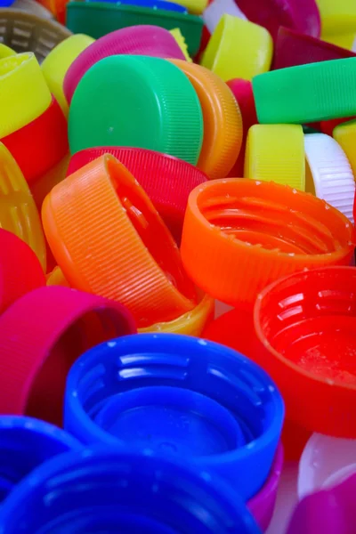 Color plastic caps background — Stock Photo, Image