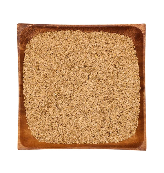 Proso w drewniana miska na białym tle — Zdjęcie stockowe