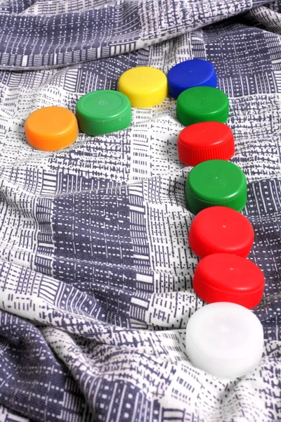 Color plastic caps background — Stock Photo, Image