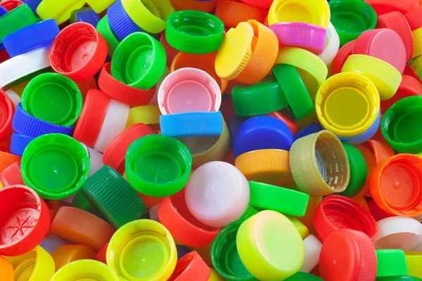 Color plastic caps background — Stock Photo, Image