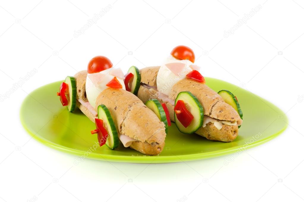 Long sandwiches with ham, cheese, tomatoes, cucumber and egg for children