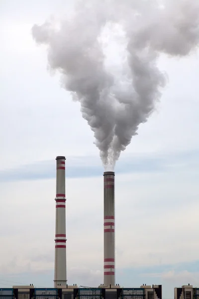 Grey smoking industrial two chimneys — Stock Photo, Image