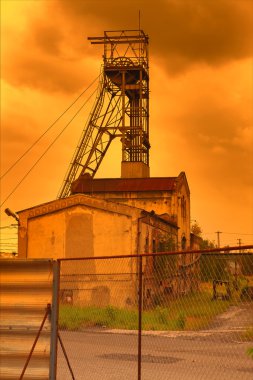 Coal mine in the sunset clipart