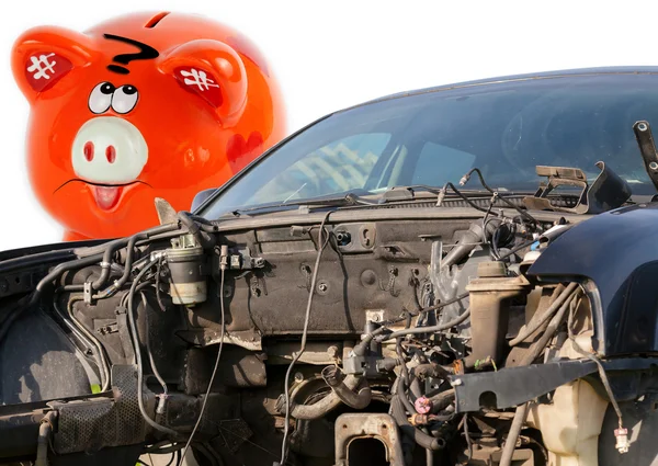 Car wreck and orange piggy bank style money box — Stock Photo, Image