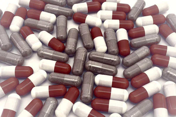 Pilulky na bílém pozadí — Stock fotografie