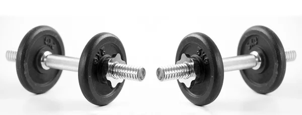 Black dumbbells on white background — Stock Photo, Image