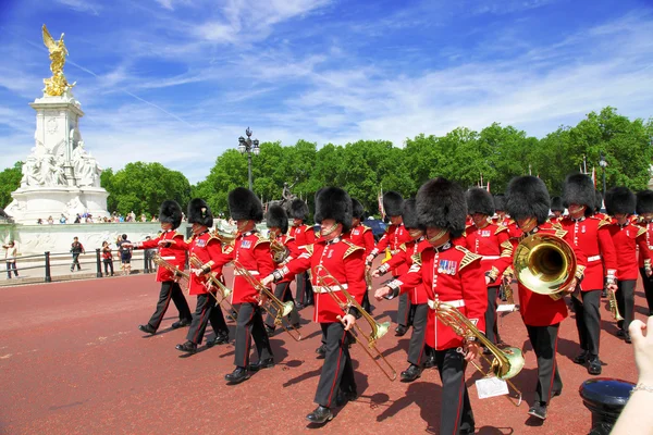 LONDON - JULY 15, 2013: British Royal guards perform the Changing of the Guard in  Buckingham Palace on July 15, 2013 in London, UK