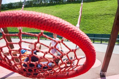 two children fun on swing round