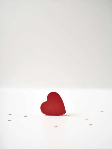 Red heart on light background. The concept of Valentine\'s day. Copy space, space for text.