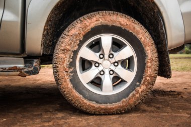 Wheel tire mess up with mud and dirt clipart