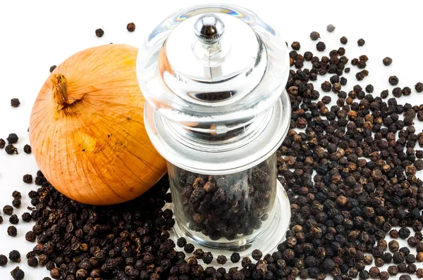 Upper of Glass pepper Grinder and fresh onion — Stock Photo, Image