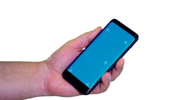 휴대폰의 파란색 템플릿은 손가락이 가리키고 — 비디오
