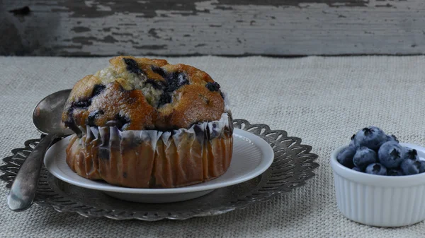 Fresh Blueberry Muffin on Rustic Burlap — Stock Photo, Image