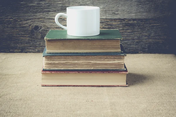 Books  with coffe cup on retro background with Instagram Style F — Stock Photo, Image