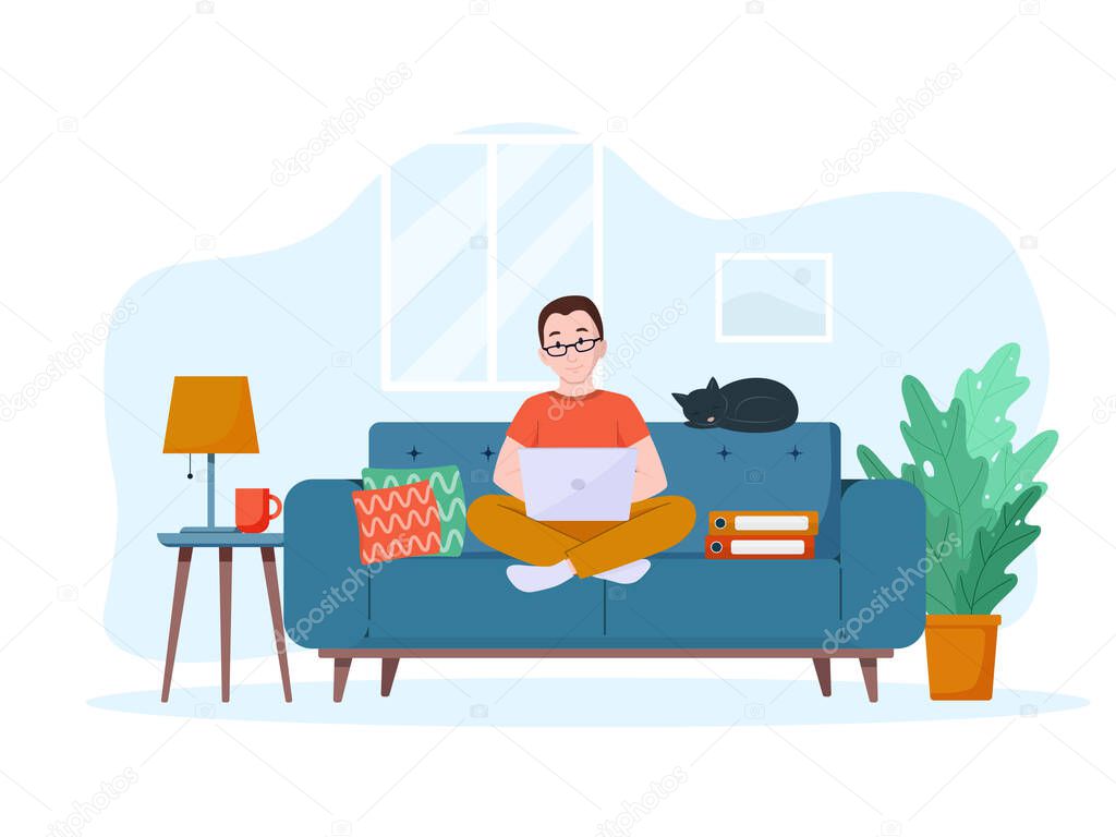 A man works on a laptop on the couch. Work from home concept. Freelance concept.