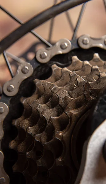 Bicycle details, gear details of gears and chain, dark abstract background, selective focus.