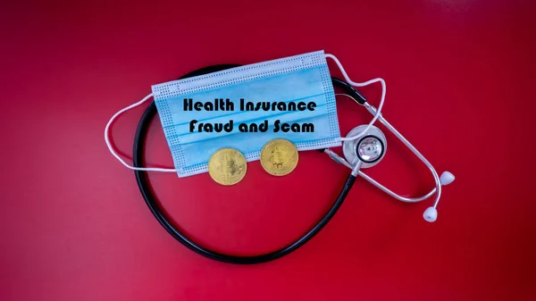 Health Insurance fraud and scam awareness to unsuspected victim. Selective focus on the statescope, mask and a bitcoin replica isolated red background