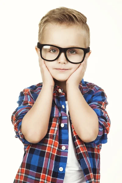 Funny child.fashionable little boy in glasses, jeans, white t-shirt and plaid shirt.stylish kid in sport shoes. fashion children closes his ears  hands — Zdjęcie stockowe