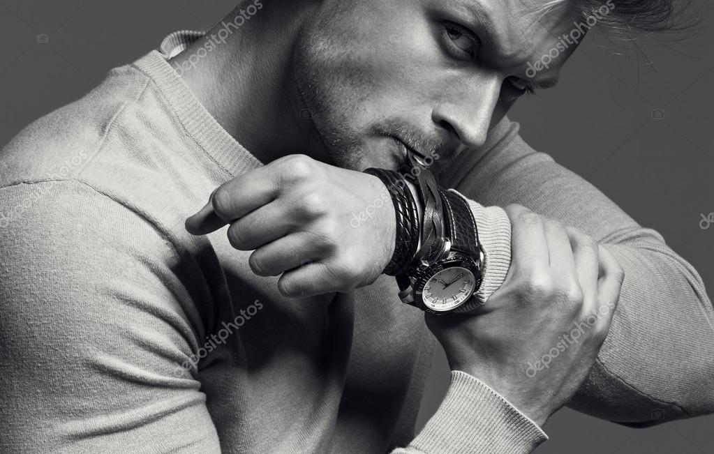 Advertising wrist watch concept. Beautiful (handsome) muscular ...