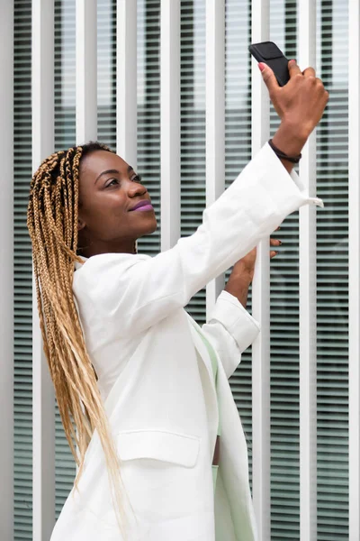 Young African American Woman Blonde Braids Taking Selfie Cellphone Vertical — Stockfoto