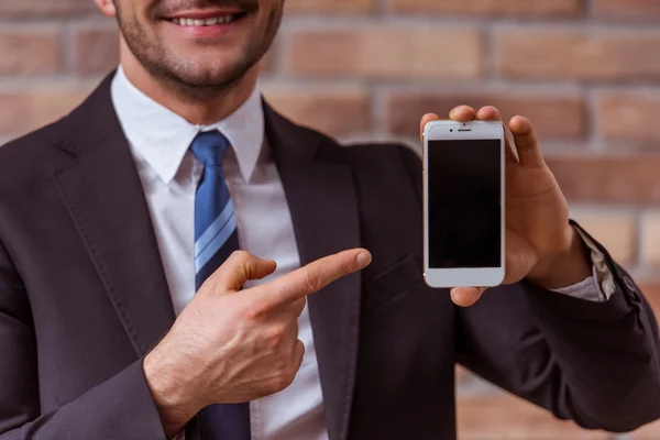 Attractive businessman with gadget — Stok fotoğraf