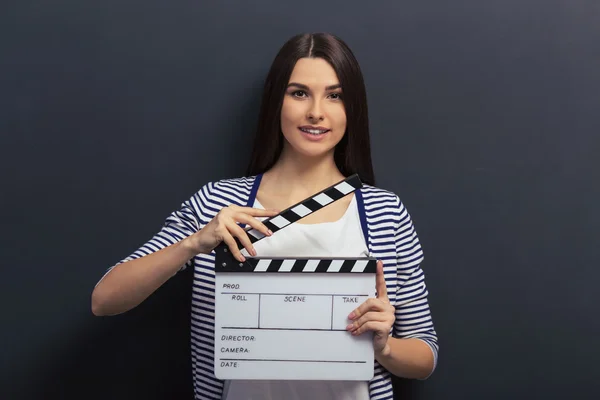 Handsome girl with clapperboard — Stock Photo, Image