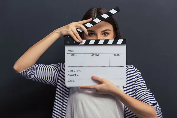 Handsome girl with clapperboard — Stock Photo, Image