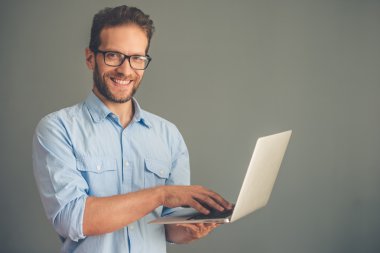 Handsome young man with gadget