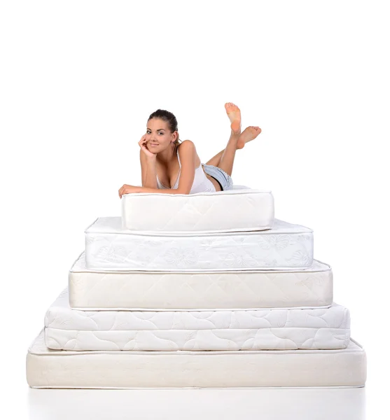 Woman and mattress — Stock Photo, Image