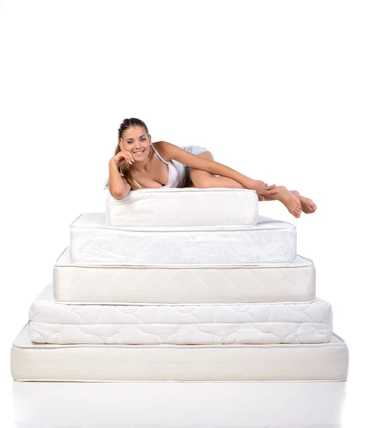 Woman and mattress — Stock Photo, Image