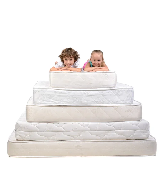 Children and many mattresses — Stock Photo, Image