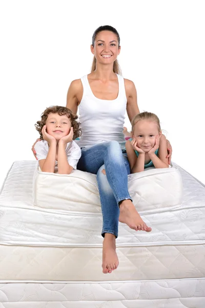 Family and many mattresses — Stock Photo, Image