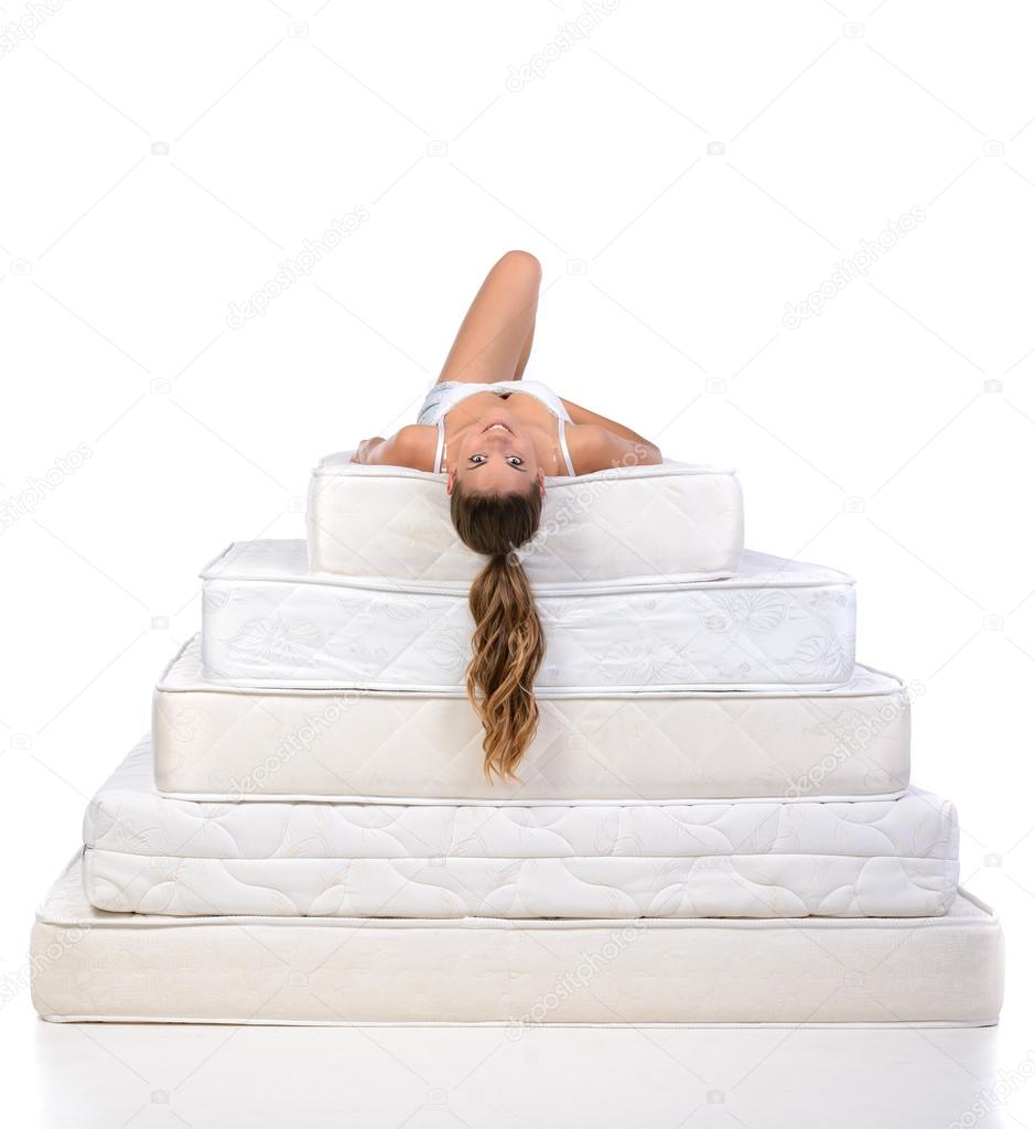 Woman and mattress Stock Photo by 57168089