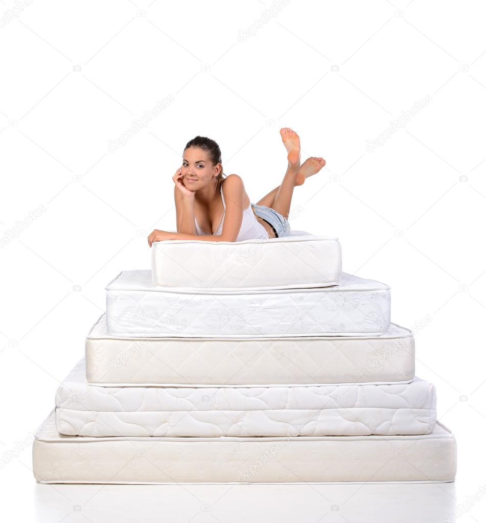 Woman and mattress Stock Photo by 57168109