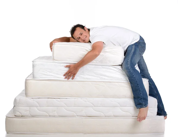 Family and many mattresses Stock Picture